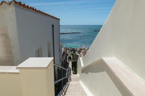 a view of the ocean from the balcony of a building at Riviera Suite in Santa Marinella