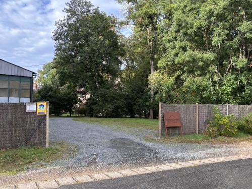 a fence with a sign on the side of a road at Domaine de La Soudelle in Chanceaux-sur-Choisille