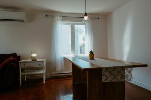 a kitchen with a island in a room with a window at St Johns Retreat Terrace 3 BR & 2 Baths in St. John's