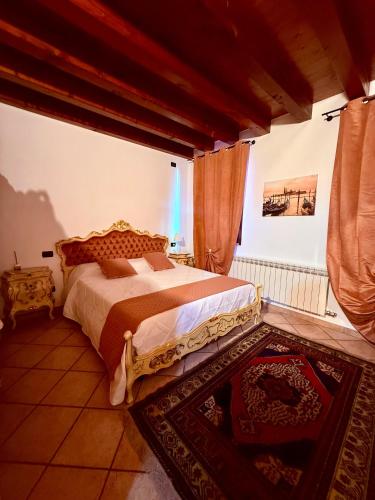 Ένα ή περισσότερα κρεβάτια σε δωμάτιο στο Ca Venice