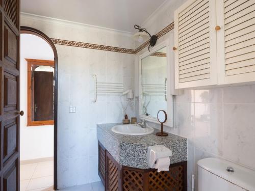 a bathroom with a sink and a mirror at Altamar 60 Balcony beach views By CanariasGetaway in Playa del Aguila