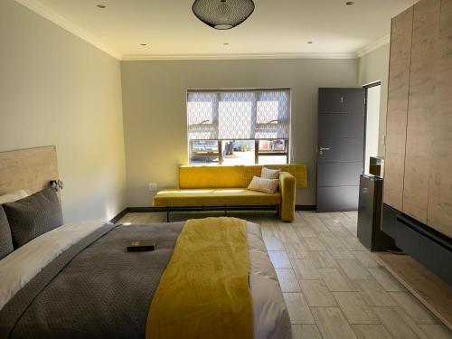 Ένα ή περισσότερα κρεβάτια σε δωμάτιο στο Hephaestus Guesthouse