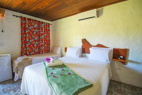 Un ou plusieurs lits dans un hébergement de l'établissement Pousada Villa Morena