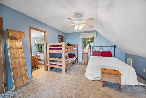 a bedroom with a bed and a ceiling fan at Time Out in Letitia
