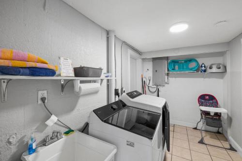 a hospital room with a machine and a sink at Waterfront oasis with NEW POOL and kayaks in Hernando Beach