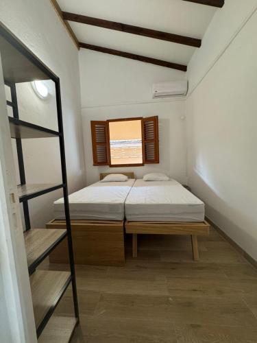 a small room with two beds and a ladder at Villa Soussoute - à 2mn de la plage de Tartane in La Trinité