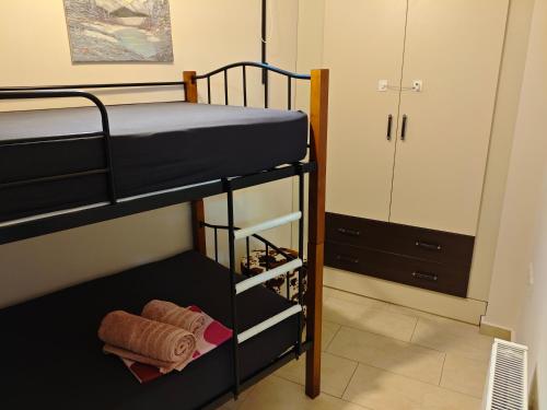 a bedroom with two bunk beds and a closet at studio apartment KAMARES in Mytilene