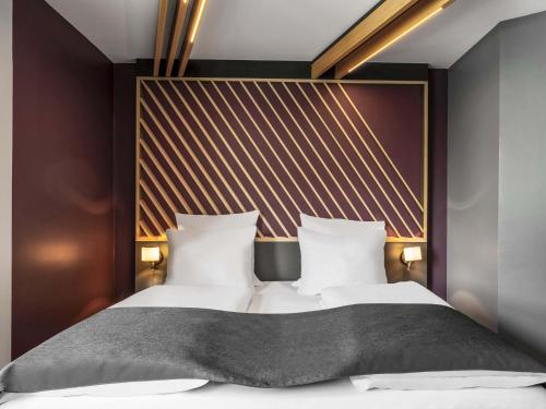 Ένα ή περισσότερα κρεβάτια σε δωμάτιο στο B&B Hotel Schweinfurt-City