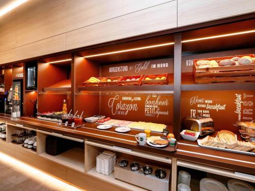 a bakery with a display of bread and pastries at B&B Hotel Salzburg-Nord in Salzburg