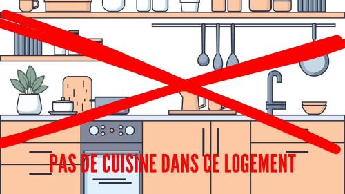 a kitchen with a sign that says pas be cuisine dills be inconvenient at Suite du Jardin 2 La chambre in Chaumont