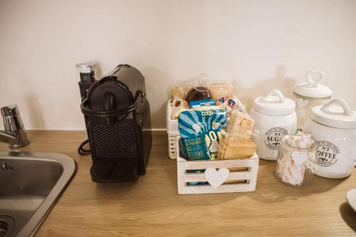 a counter with bread and other items on it at as maison in Terni