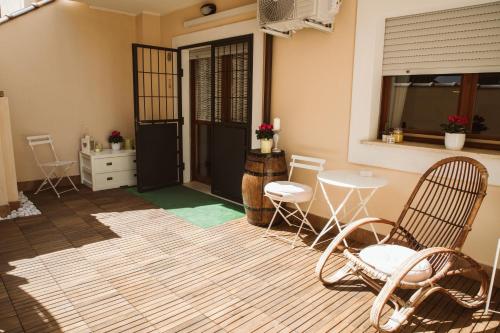 a room with chairs and a table and a door at as maison in Terni