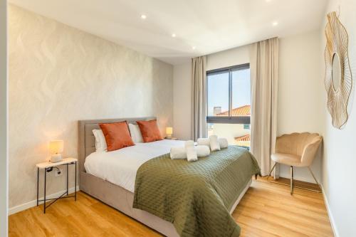 Ένα ή περισσότερα κρεβάτια σε δωμάτιο στο Garajau Sea Side by Atlantic Holiday