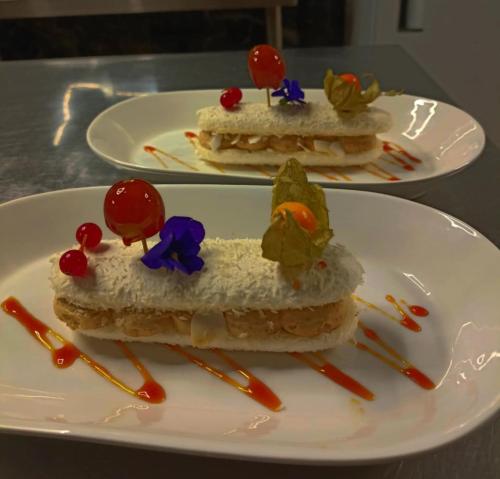 two plates of food on a white plate at La Sapinière St Lary Soulan in Saint-Lary-Soulan