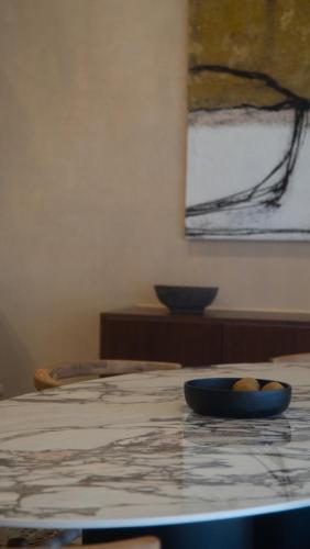 a bowl of fruit sitting on top of a table at Minimalist elegance by the beach in Zihuatanejo