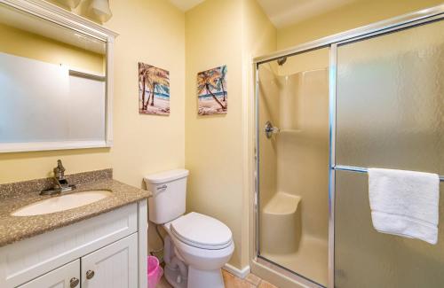 a bathroom with a shower and a toilet and a sink at K1410 Loggerhead Landing - Oceanside Condo Just Steps to the Beach! in Croatan Shores