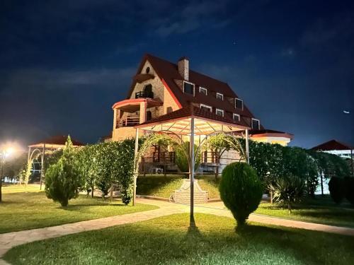 a large house with a gazebo in front of it at Hotel Marani Sanavardo 