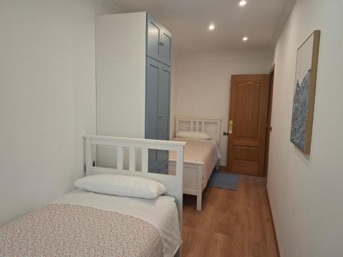 Postel nebo postele na pokoji v ubytování Apartamento Lugo Muralla