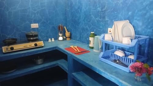 a toy kitchen with a blue counter top at Beach Front Bungalow in Jambiani