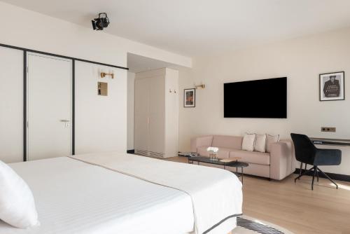 ホテル アストラ オペラ アストテルにあるテレビまたはエンターテインメントセンター