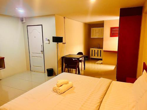 Postel nebo postele na pokoji v ubytování MK Residence, Pattaya