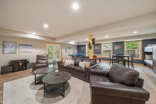 a living room with a couch and a table at Pine Ridge Retreat in Beech Mountain
