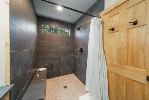 a bathroom with a shower with a shower curtain at Pine Ridge Retreat in Beech Mountain