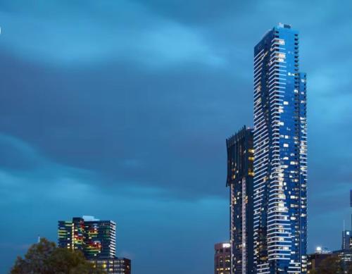 a tall building in a city at night at ES2410-2Bed 2Bath Vision Apt with Balcony, Pool & Gym in Melbourne