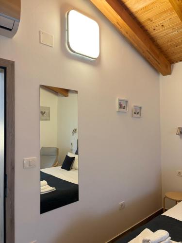 a mirror in a room with two beds at Villa Silver Novigrad with private pool in Novigrad Istria