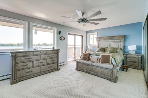a bedroom with a bed and a ceiling fan at Spacious Riverfront Home with Dock in St Clair! in St. Clair