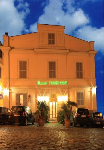 a building with cars parked in front of it at Albergo Panorama in Frascati