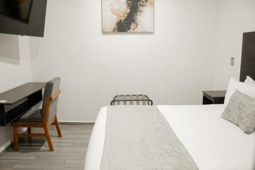 Hotel Del Centro HCにあるベッド