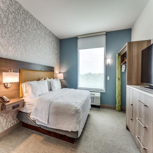 a hotel room with a bed and a window at Home2 Suites By Hilton Fort Worth Arlington West in Fort Worth