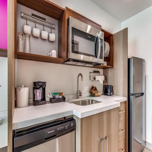 a kitchen with a sink and a microwave at Home2 Suites By Hilton Fort Worth Arlington West in Fort Worth