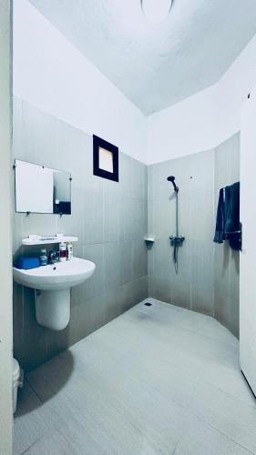 a bathroom with a sink and a mirror at CHIC cozy appart bonoumin in Abidjan