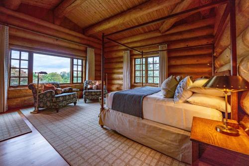 a bedroom with a bed in a log cabin at Welcome to the Lodge! Little Falls NY in Little Falls