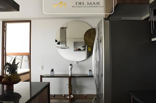 a kitchen with a mirror and a counter at Altamar in Nuevo Vallarta 