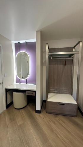a bathroom with a sink and a mirror at Costa Mesa Inn - Newport Beach Area in Costa Mesa