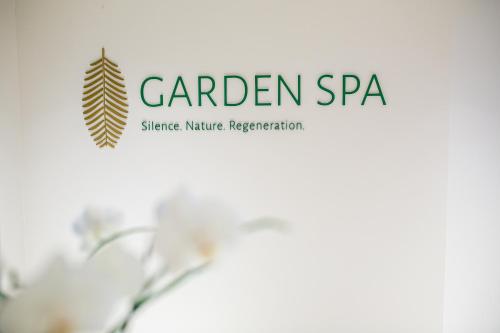a logo for a garden spa with a plant at Hotel San Giorgio Resort 4S in Caorle