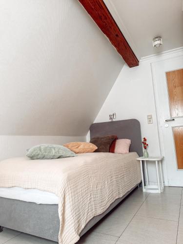 a bedroom with a bed in a attic at Hotel Restaurant Ratsstube in Calw