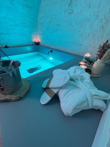 a towel sitting on a counter next to a bath tub at DORO' suite & luxury rooms in Noci