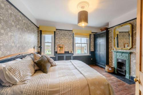 En eller flere senge i et værelse på Riverside Cottage - Rye