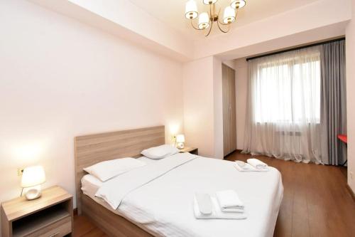 Postel nebo postele na pokoji v ubytování Apartments by MR Yeravan in the city centre