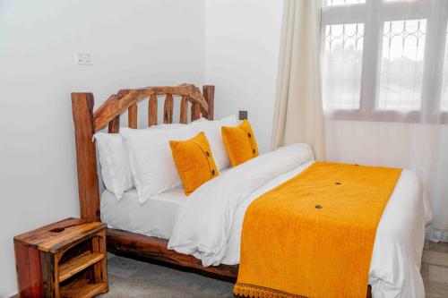 Postel nebo postele na pokoji v ubytování The Nook at Njiro 39 - 3BR by Kyada Stays