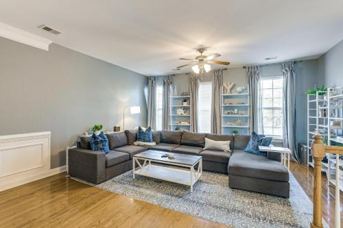 a living room with a couch and a table at Townhome 3 Mi to Wescott Park and Golf Course! in Ladson