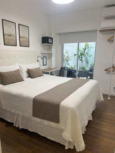 Postel nebo postele na pokoji v ubytování Hotel Alvear