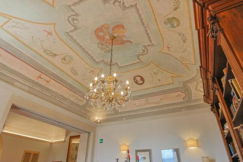 a ceiling with a chandelier in a room at Hotel Villa Sermolli in Borgo a Buggiano