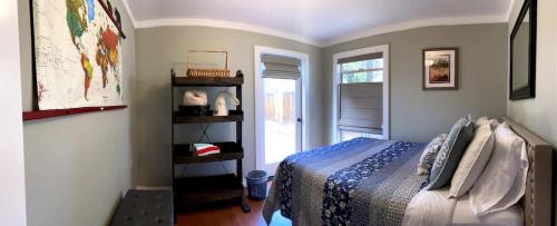 a bedroom with a bed and a window at Family Friendly Charming Truckee Getaway Walk to Shops & Dining in Meadow Lake Park