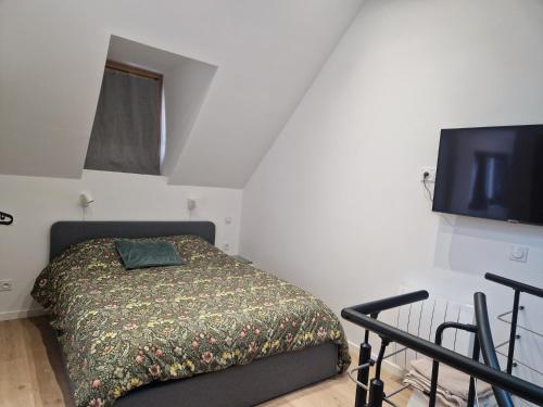 Katil atau katil-katil dalam bilik di Appartement duplex hypercentre
