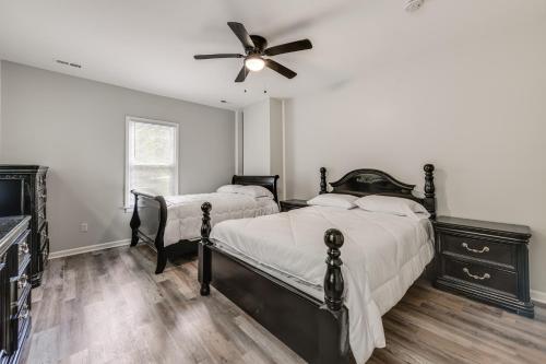 a bedroom with two beds and a ceiling fan at 11 Mi to Fort Lee 30-Acre Retreat with Scenic Views in Pickadat Corner